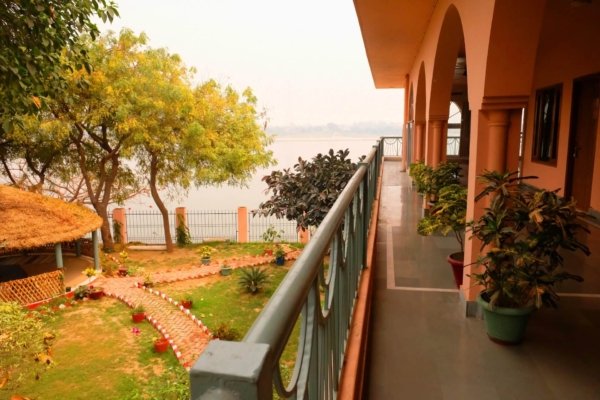 Top floor accommodations, deck outside guest rooms. View of Ganges River.